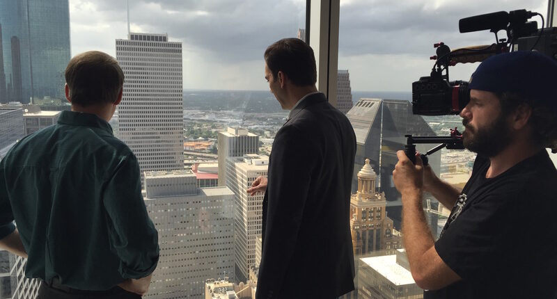 Taylor shooting the Houston skyline scene