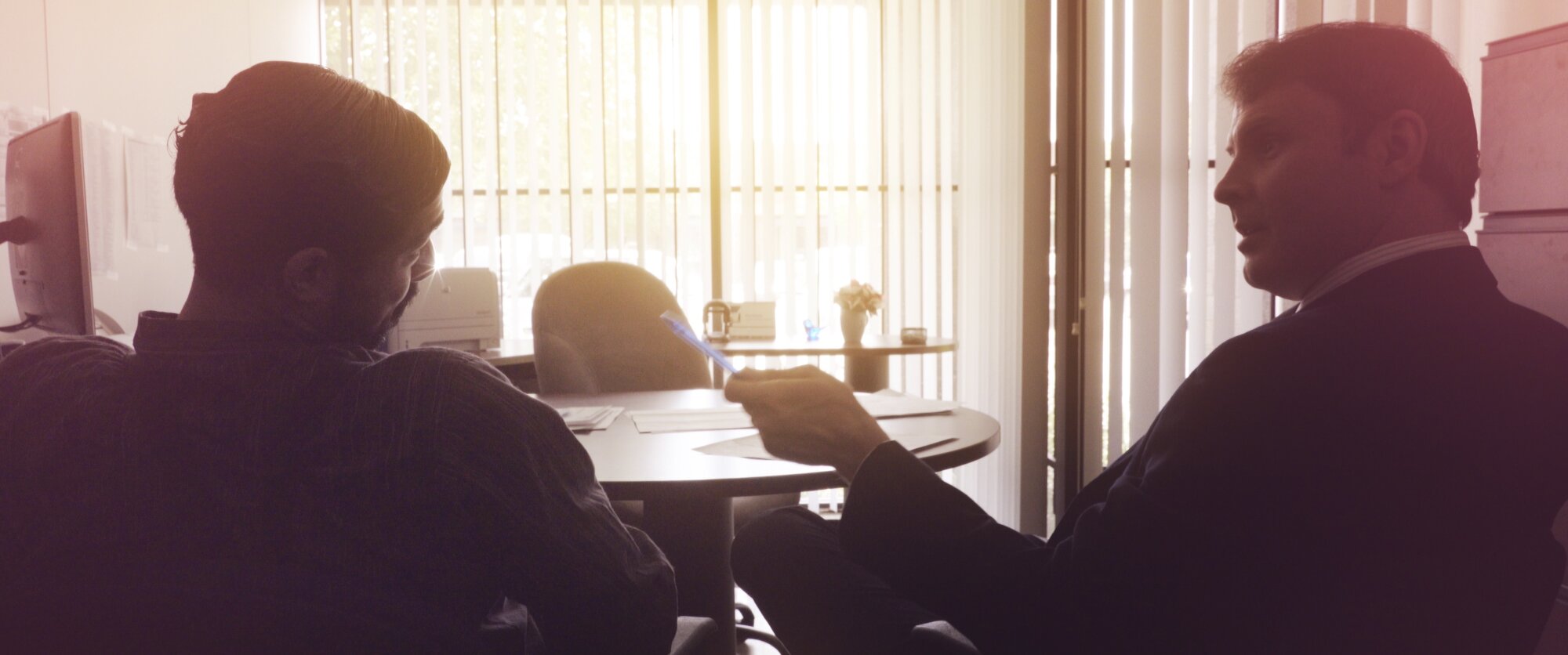 Frank in an office meeting