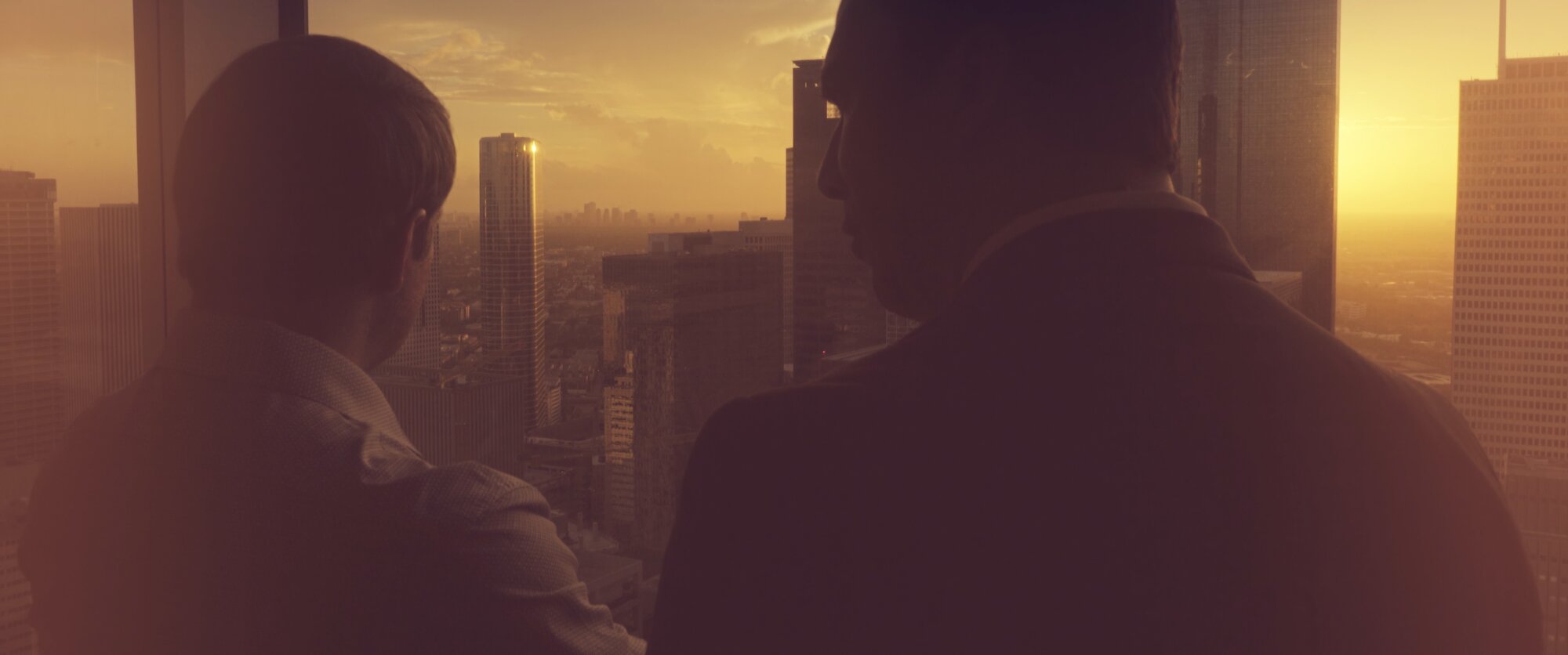 Frank and son overlooking Houston skyline at sunset