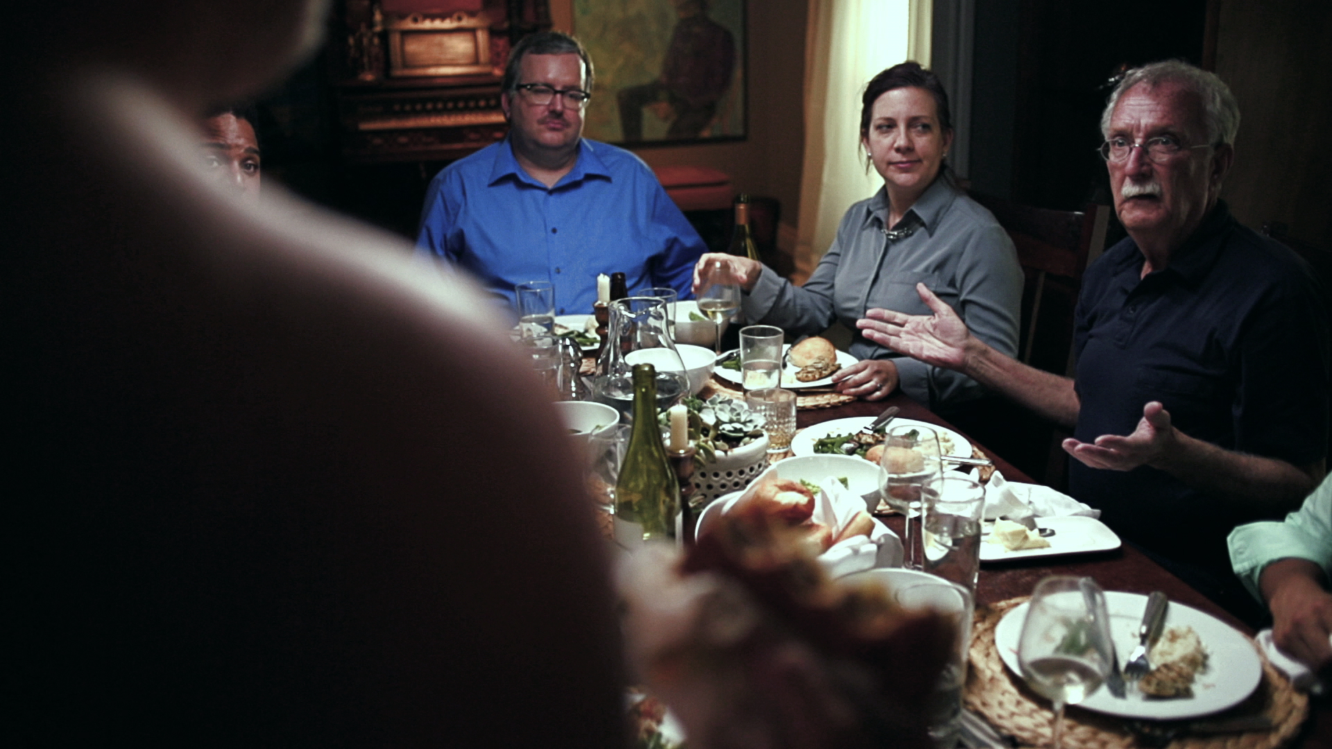 Film still. Family dinner table