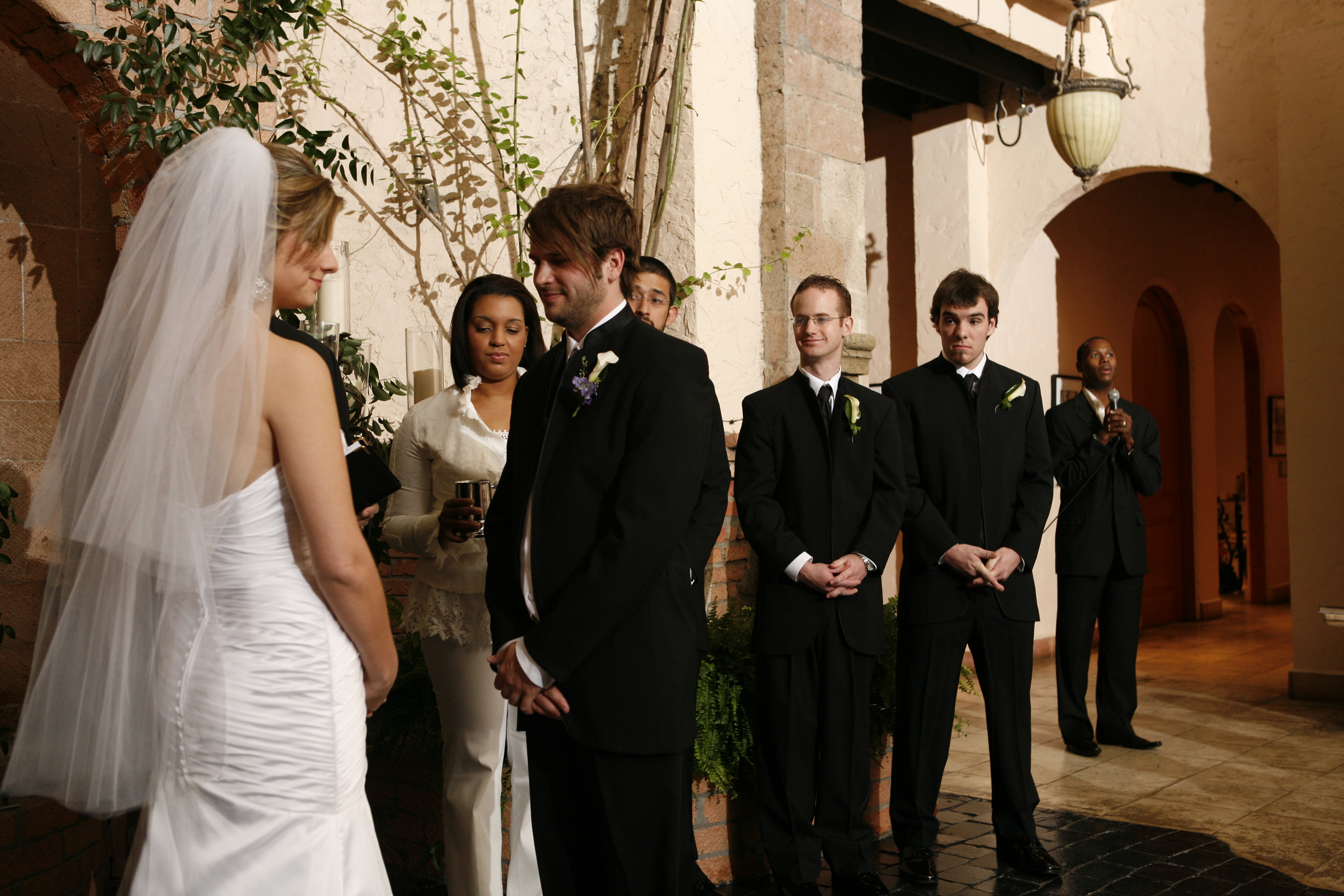 Taylor and Stephanie receiving communion at their wedding. Heidi Stampley serving, Micah Stampley singing a solo in the background